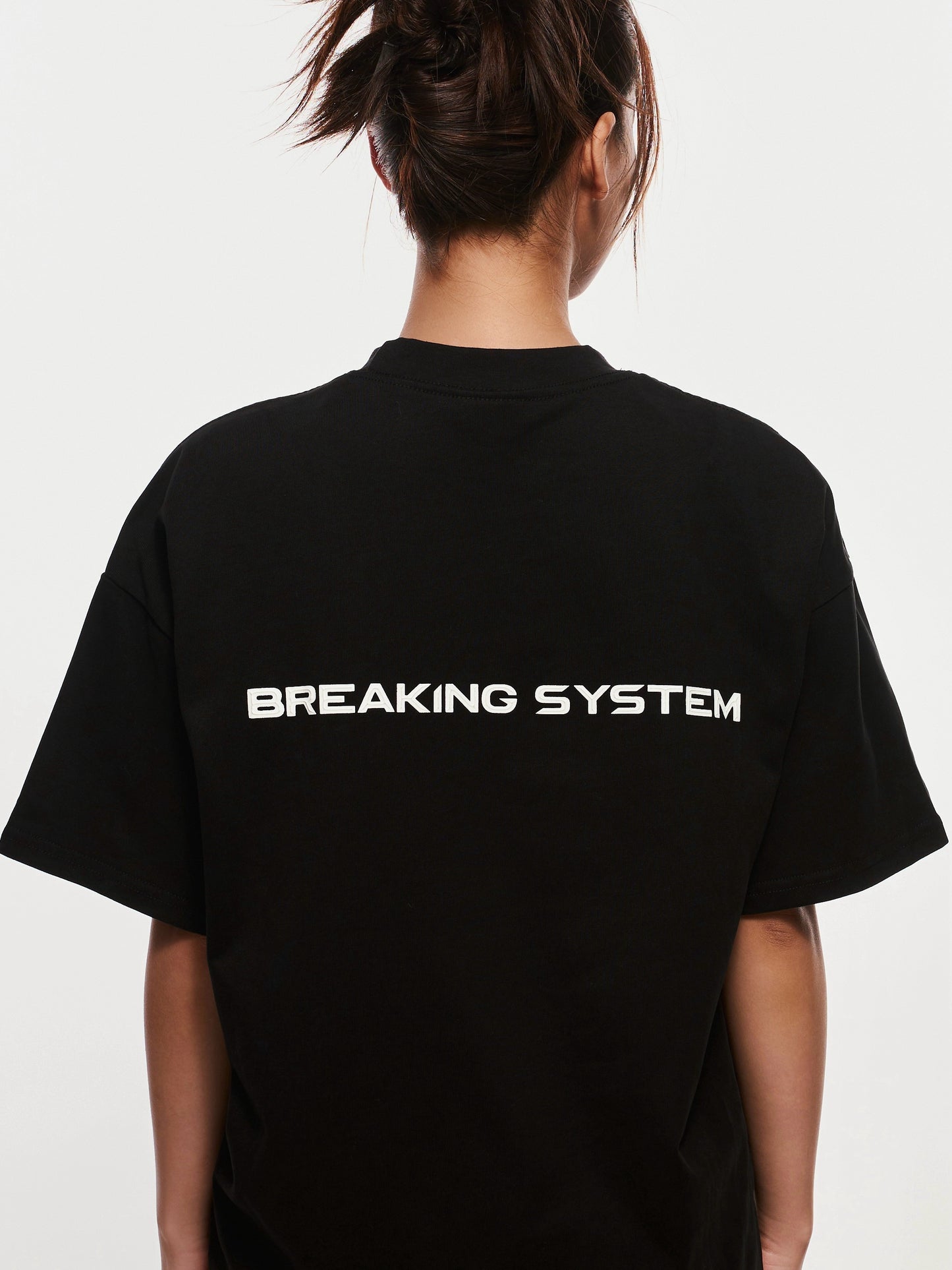 Breaking System Black Tee – Oversized fit, premium streetwear T-shirt for modern urban style